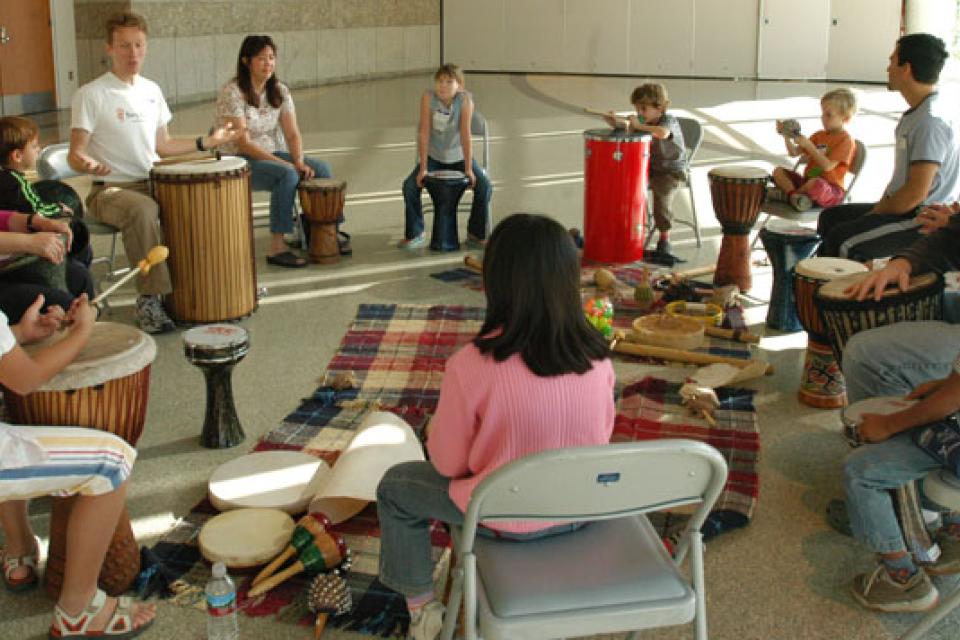 Chris Reid leads participants of Multicultural Drumming Workshop